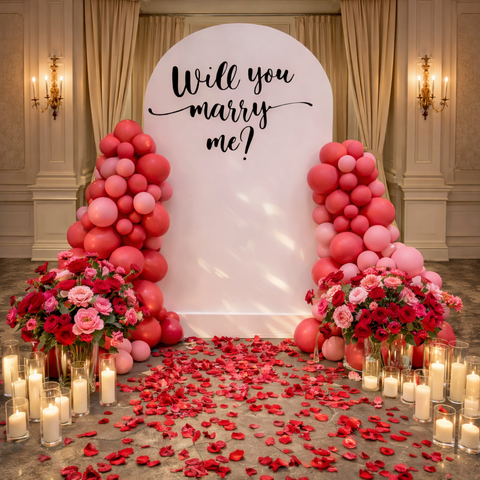 Decorated room with balloons, flowers, and 'Will you marry me?' sign in Abu Dhabi.