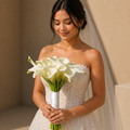 Bride holding a bouquet of white flowers from danaya's flowers
