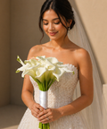 Bride holding a bouquet of white flowers from danaya's flowers
