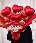 Luxury Valentine’s Day heart balloon bouquet with red balloons and premium wrapping