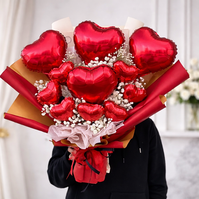 Luxury Valentine’s Day heart balloon bouquet with red balloons and premium wrapping