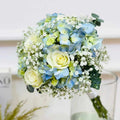 Bouquet of blue and green flowers with a blurred background