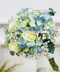 Bouquet of blue and green flowers with a blurred background
