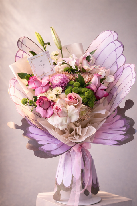 Luxury butterfly flower bouquet with pink roses and elegant wrapping in Abu Dhabi