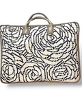 Woven bag with black floral pattern on a white background