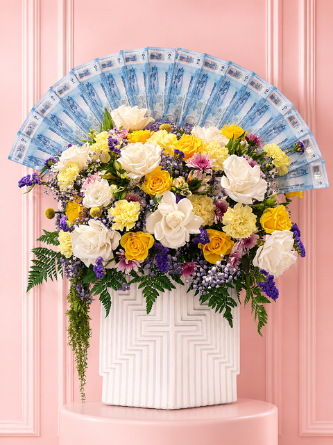 Grand money flower arrangement with white and yellow roses and a fan of UAE banknotes in a modern white ceramic vase by Danaya’s Flowers Abu Dhabi.