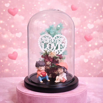Romantic couple figurine inside a glass dome with love heart decor, perfect gift for couples and Valentine’s Day