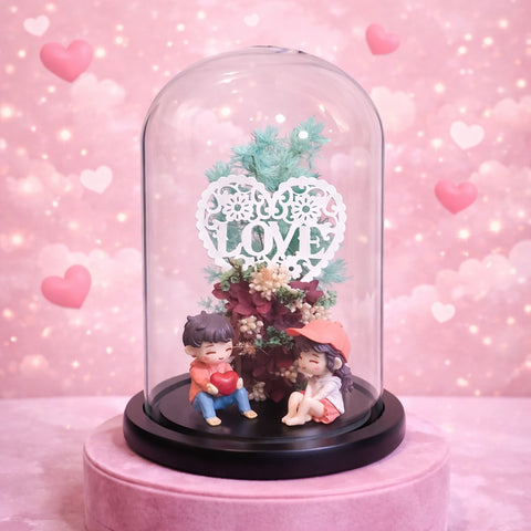 Romantic couple figurine inside a glass dome with love heart decor, perfect gift for couples and Valentine’s Day