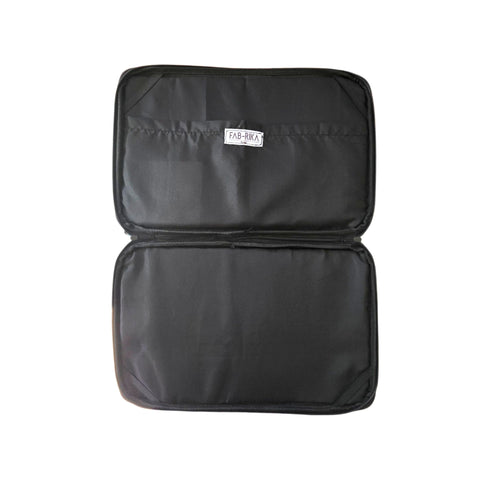 interior of laptop bag with a visible brand label Fab-Rika