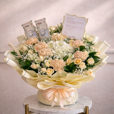 Elegant cream money flower bouquet with white hydrangea, champagne carnations, spray roses, and UAE banknotes in luxury ivory wrapping by Danaya’s Flowers Abu Dhabi.