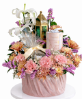 Luxury Ramadan flower arrangement with pink carnations, chrysanthemums, white lilies, chocolates and decorative lantern by Danaya’s Flowers in Abu Dhabi.