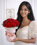 Luxury red roses flower box arranged in an elegant pink velvet container, perfect for romantic gifting, anniversaries, and Valentine’s Day in Abu Dhabi.