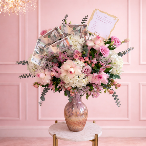 Luxury pink money bouquet with roses hydrangeas and cash notes in vase by Danaya's Flowers Abu Dhabi
