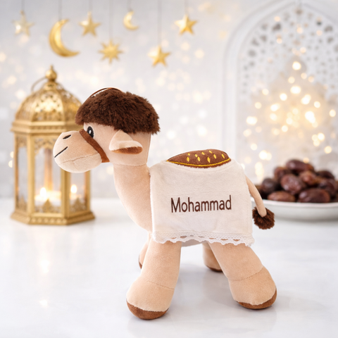 Personalized plush camel toy with Mohammad name embroidery in bright Ramadan setting with lantern and dates, UAE Eid gift