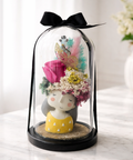 Preserved rose girl figurine in glass dome with butterfly accent and dried flowers