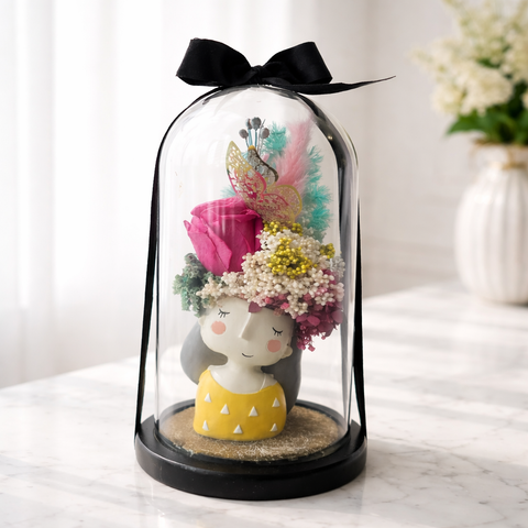 Preserved rose girl figurine in glass dome with butterfly accent and dried flowers