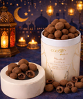 Ramadan coffee covered milk chocolate gift box with lantern and mosque background in Abu Dhabi