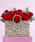 Valentine’s Day red roses styled in an artisan handbag.