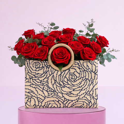 Valentine’s Day red roses styled in an artisan handbag.