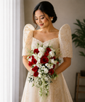 Filipina bride holding a luxury red and white cascading bridal bouquet with premium artificial flowers.