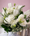 Elegant white tulip and rose flower bouquet with soft greenery and pearls, luxury floral arrangement in Abu Dhabi